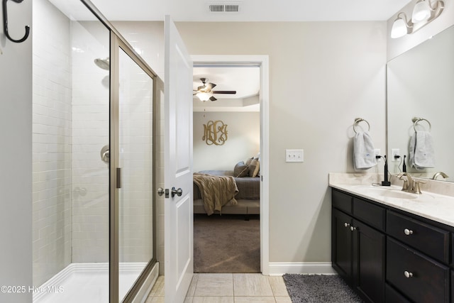 bathroom featuring visible vents, a shower stall, vanity, and ensuite bathroom