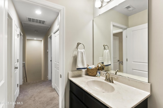 bathroom with visible vents and vanity