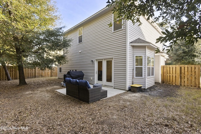 back of property featuring a patio and a fenced backyard