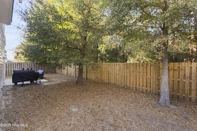 view of yard with a fenced backyard