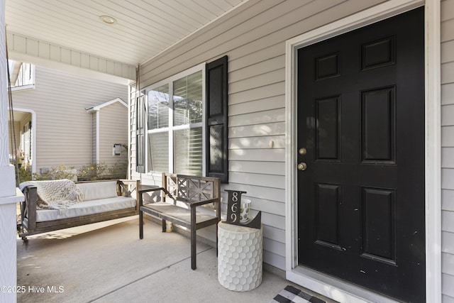 doorway to property featuring a porch