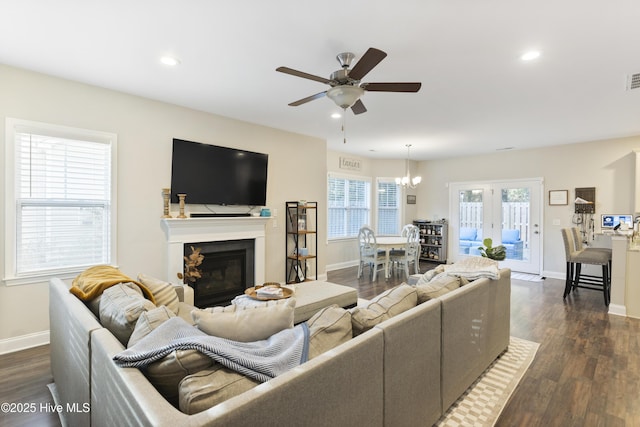 living room with baseboards, dark wood-style flooring, and recessed lighting