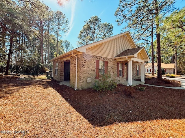 view of front of house with brick siding