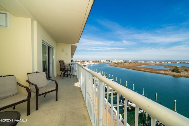 balcony featuring a water view