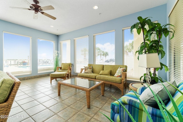 sunroom featuring ceiling fan