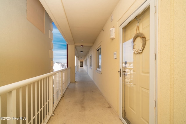 hall featuring concrete floors