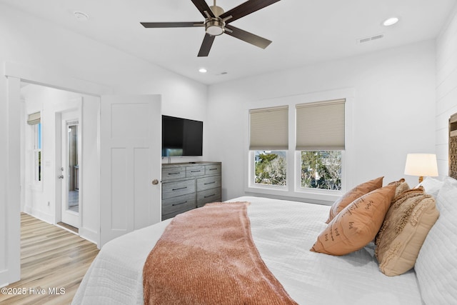 bedroom featuring light wood finished floors, visible vents, recessed lighting, and a ceiling fan