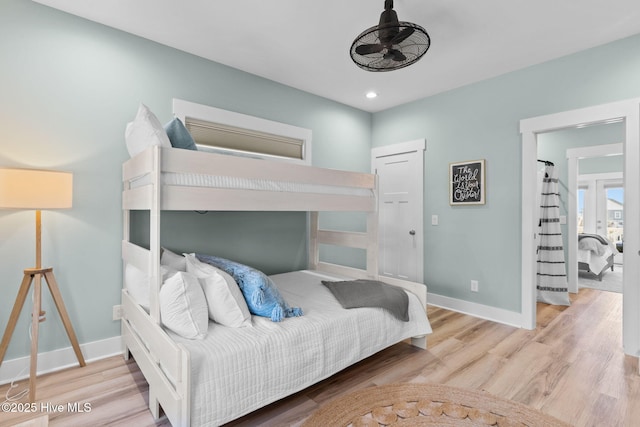 bedroom featuring recessed lighting, baseboards, and wood finished floors