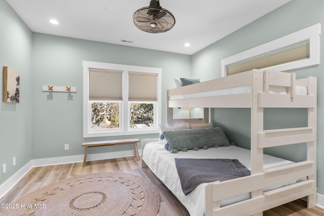 bedroom featuring visible vents, recessed lighting, wood finished floors, and baseboards