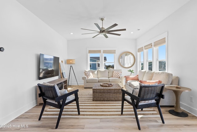 living area with a ceiling fan, visible vents, baseboards, recessed lighting, and light wood-type flooring