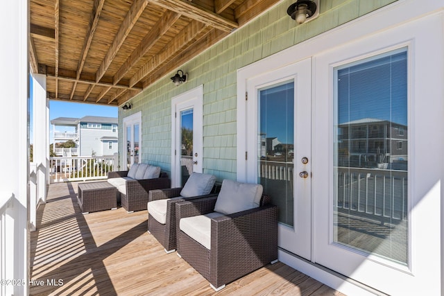 wooden terrace featuring french doors