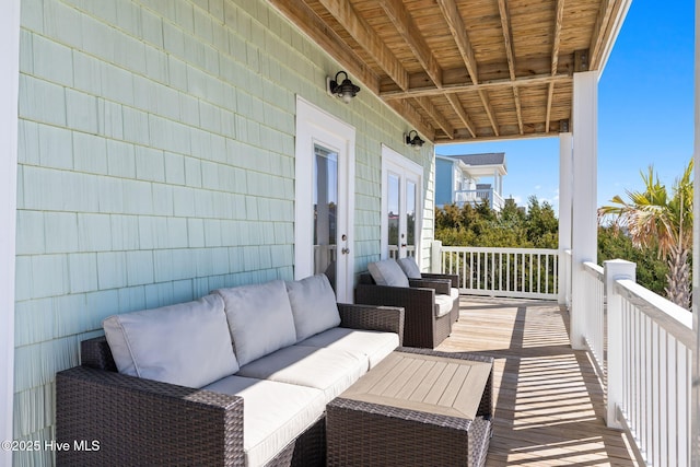 exterior space featuring an outdoor living space and french doors