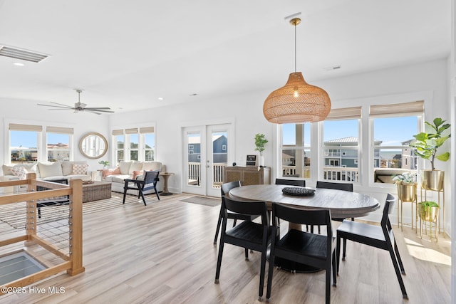 dining area featuring light wood finished floors, visible vents, recessed lighting, and a ceiling fan