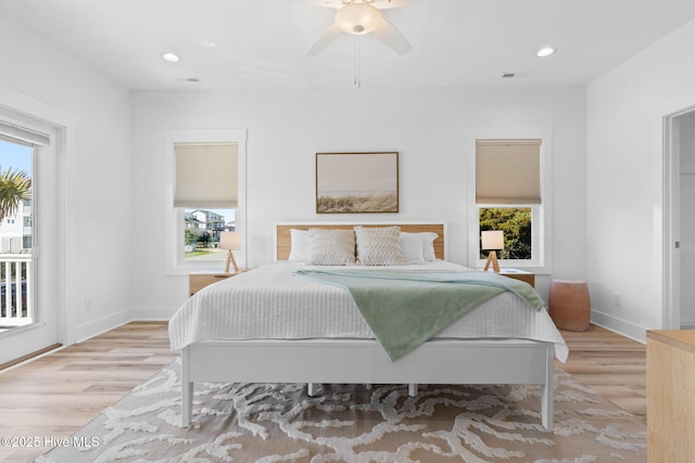 bedroom featuring recessed lighting, visible vents, multiple windows, and light wood-style floors