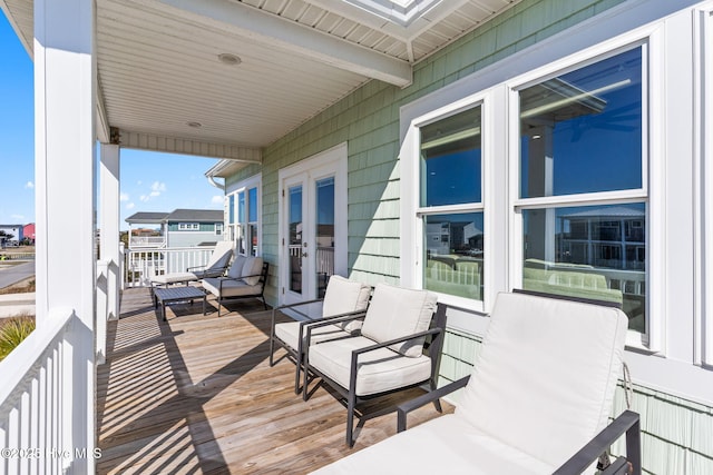 wooden terrace featuring french doors