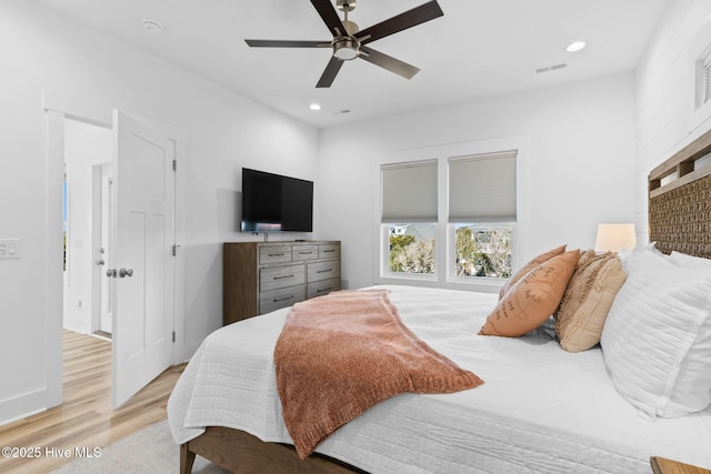 bedroom featuring a ceiling fan, recessed lighting, visible vents, and light wood finished floors