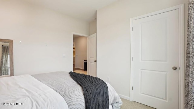 bedroom with light colored carpet