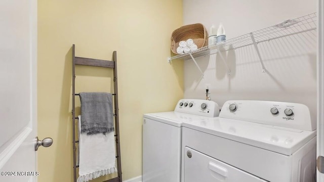 clothes washing area with laundry area and washing machine and dryer