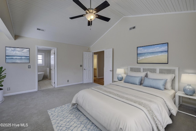 bedroom with vaulted ceiling, carpet floors, visible vents, and baseboards