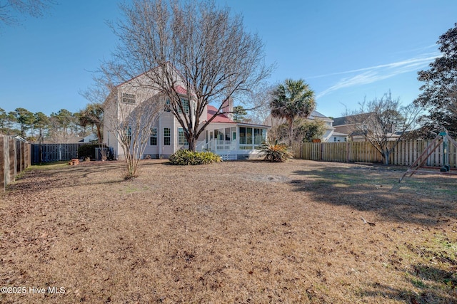 view of yard with a fenced backyard