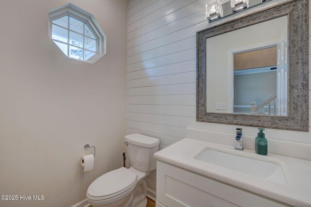 bathroom featuring toilet and vanity