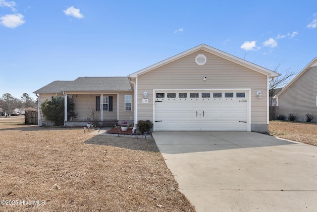 ranch-style home featuring driveway, covered porch, and a garage