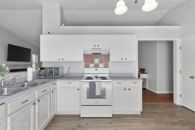 kitchen featuring white cabinets, electric stove, lofted ceiling, under cabinet range hood, and a sink