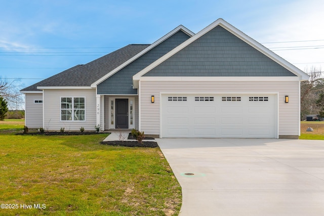 view of front facade with an attached garage, roof with shingles, concrete driveway, and a front yard