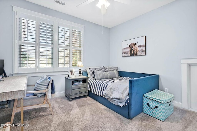 carpeted bedroom featuring visible vents, ceiling fan, and baseboards