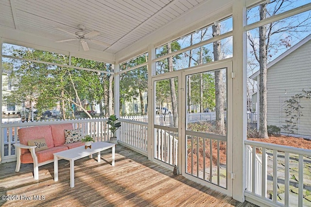 sunroom with wooden ceiling, ceiling fan, and a wealth of natural light