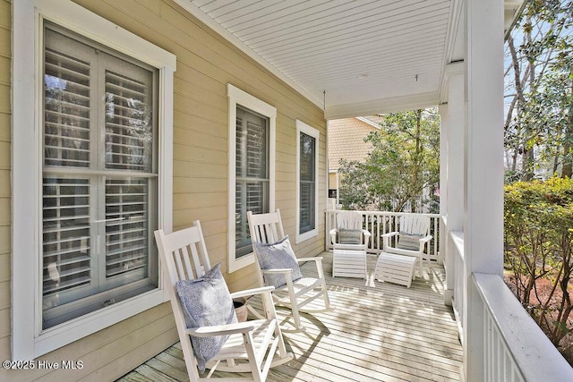 wooden terrace featuring a porch