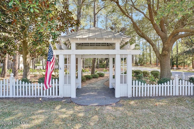 exterior space featuring a gazebo and fence