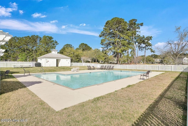 view of pool with a fenced in pool, a patio area, a lawn, and fence