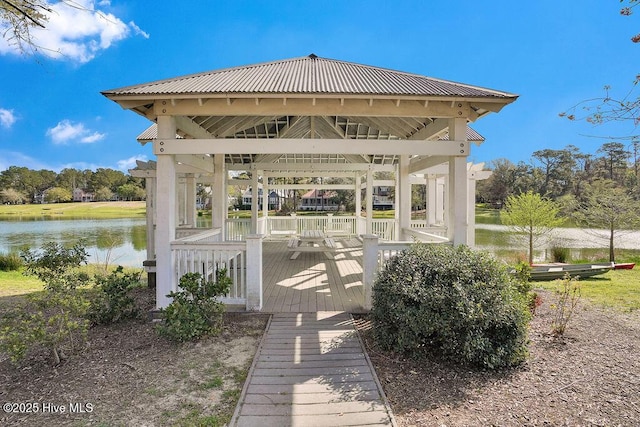 exterior space with a gazebo and a water view