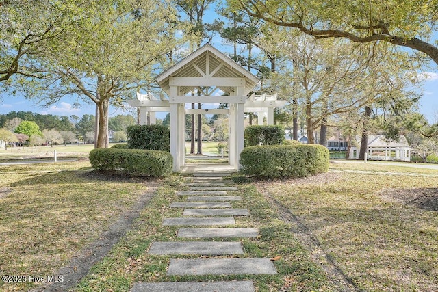 view of property's community with a lawn