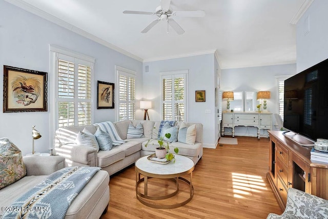 living room with light wood finished floors, ceiling fan, and crown molding