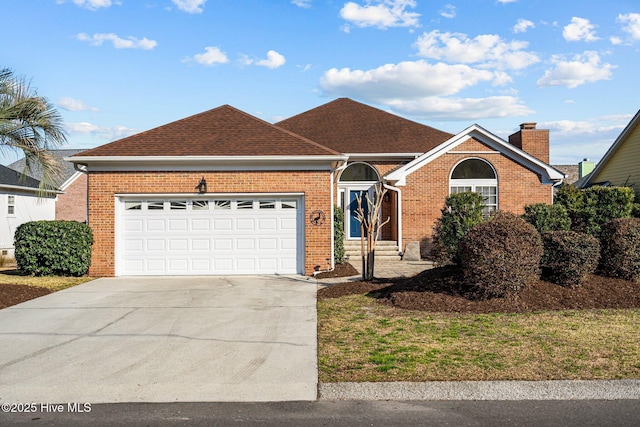 single story home featuring a garage, concrete driveway, brick siding, and a shingled roof