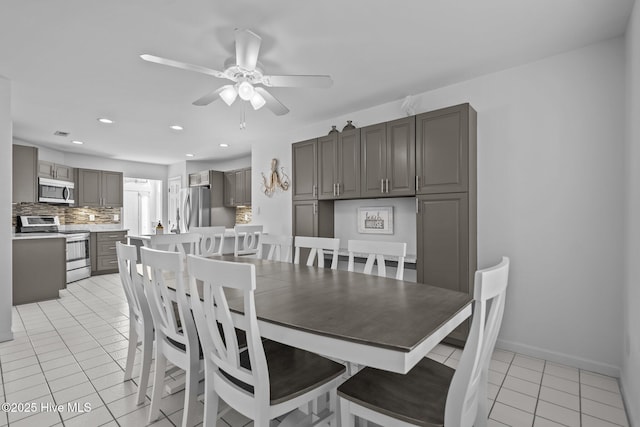 dining area with light tile patterned floors, ceiling fan, baseboards, and recessed lighting