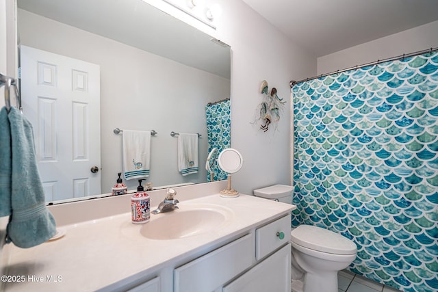 full bathroom with toilet, tile patterned floors, curtained shower, and vanity