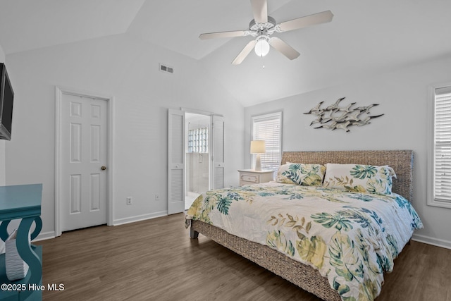 bedroom with lofted ceiling, wood finished floors, a ceiling fan, visible vents, and baseboards