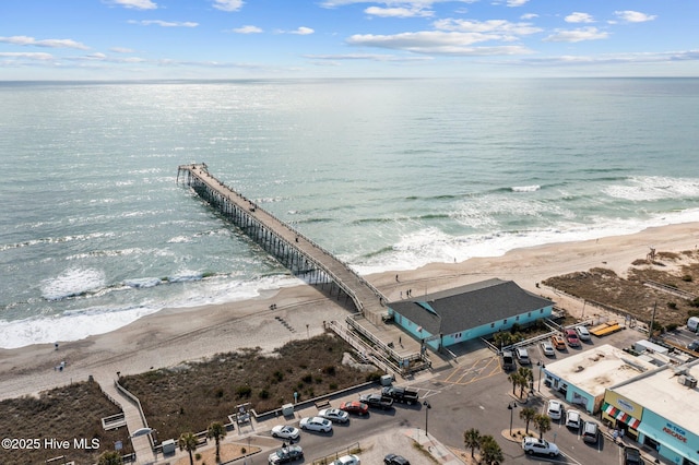 aerial view featuring a view of the beach and a water view