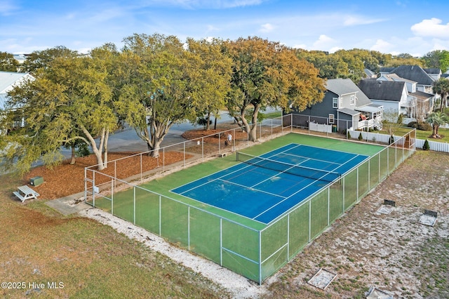 view of tennis court with fence