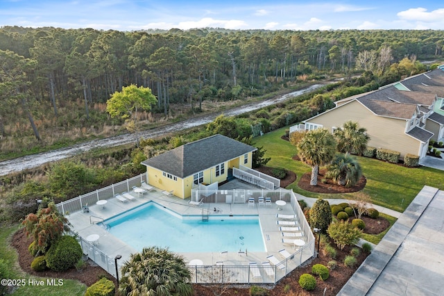 birds eye view of property with a forest view