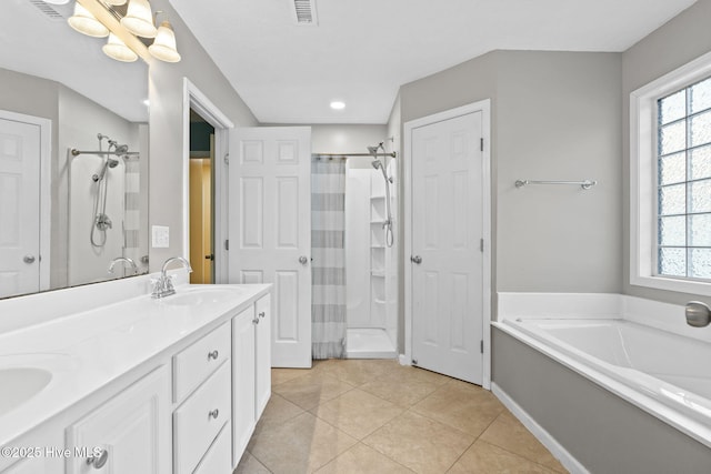 full bath featuring a stall shower, plenty of natural light, visible vents, and a sink