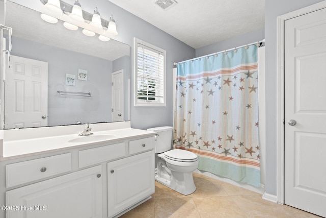 bathroom featuring curtained shower, tile patterned flooring, toilet, vanity, and visible vents