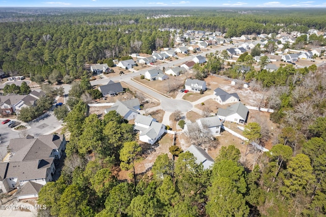 bird's eye view with a residential view and a view of trees