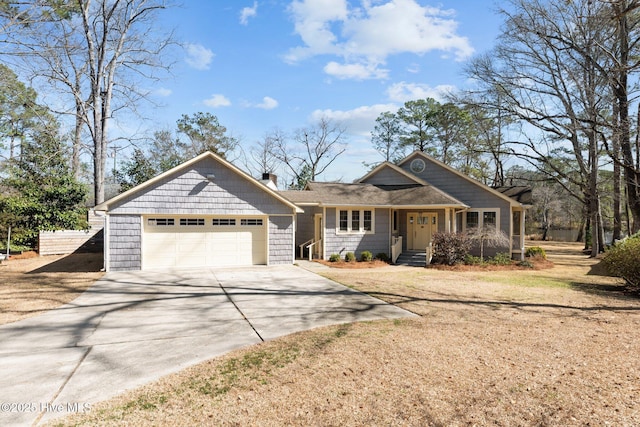 view of front of property with a garage and driveway