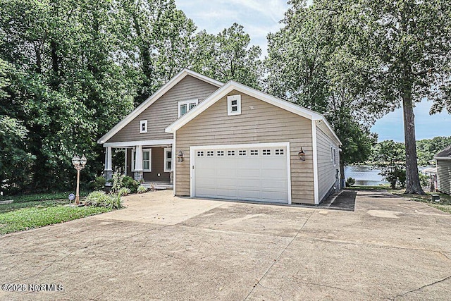 view of front of home with an attached garage and concrete driveway