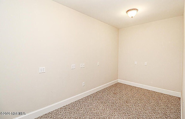 carpeted empty room with baseboards