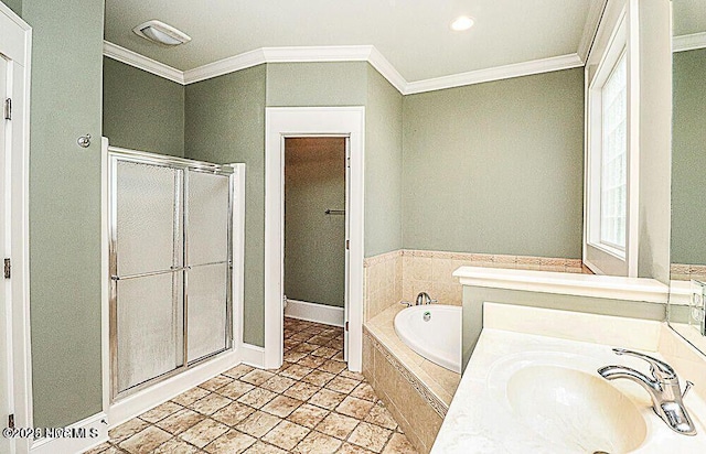 full bath featuring a garden tub, a sink, baseboards, ornamental molding, and a stall shower